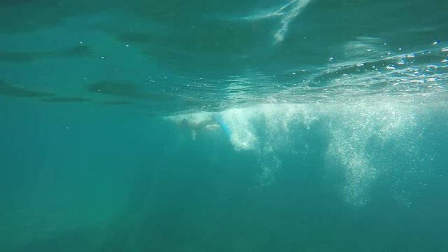 swimmer in flippers swim into the sea, raw, 4K