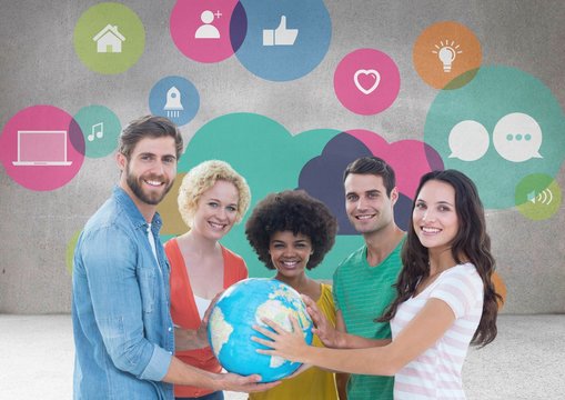 Group of people holding world globe in front of app graphics