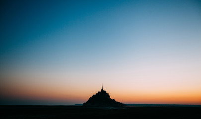 Le Mont Saint-Michel tidal island in beautiful twilight at dusk, Normandy, France