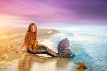 Blonde beautiful Siren Mermaid . Mermaid girl with pink tail put feet in water. Top view. Fun, vacation concept. Text space