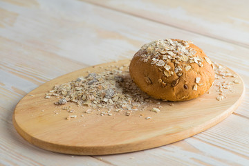 bread bun on wooden board