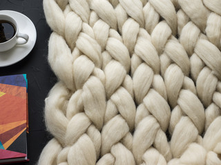 Fototapeta na wymiar Cozy composition, closeup merino wool blanket, warm and comfortable atmosphere. Knit background