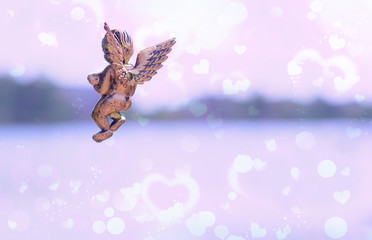 Love is anywhere, little Kupidon Amour flying in open air. Concept of peace and harmony