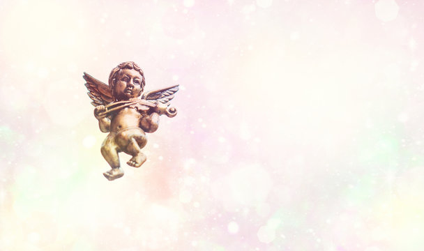 Love is anywhere, little Kupidon Amour flying in open air. Concept of peace and harmony