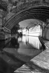 Channel Certovka and watermill near Charles Bridge in Prague in autumn.