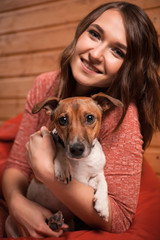 Happy young woman and dog at Christmas