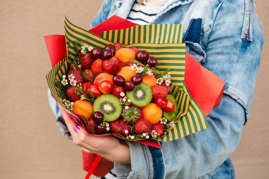 Woman Holding Fruit Bouquet