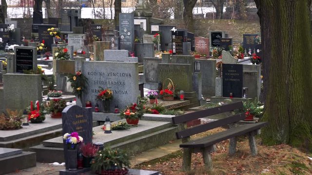 Graves with flowers and candles in an old graveyard