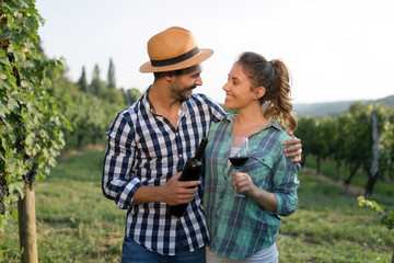 Romantic couple in vineyard before harvesting