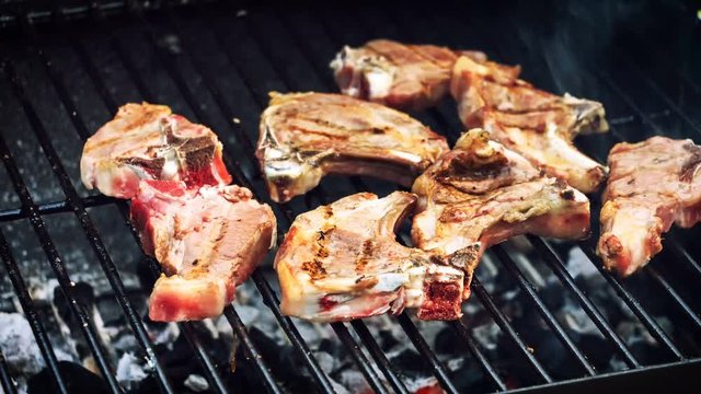 Lamb chops cooking on barbecue grill. Food background