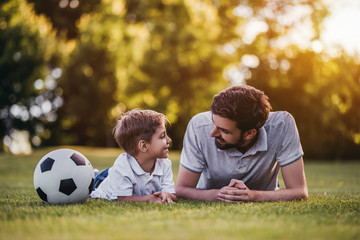 Fototapeta premium Dad with son playing football
