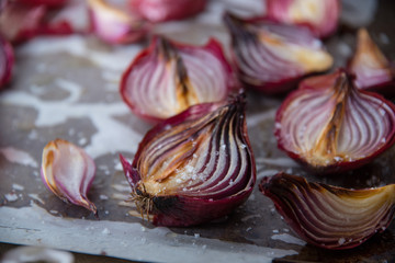 Roasted and Salted Spanish Onions on rustic baking tray and baking paper