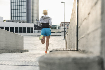 Woman running in the city