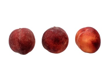 A few ripe peaches isolated on a white background