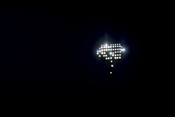 stadium lights reflectors against black background