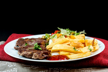 juicy steak beef meat with tomato and french fries