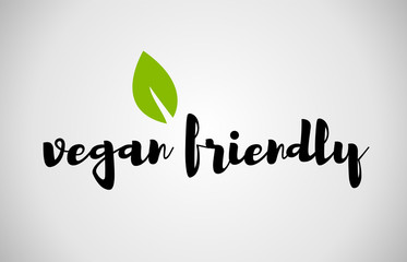 Vegan friendly green leaf handwritten text white background