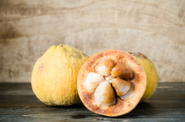 Ripe santol fruit on wooden background,Tropical fruit