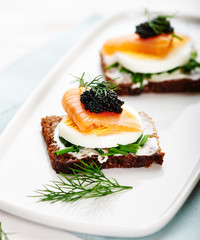 Smoked salmon with caviar on bread