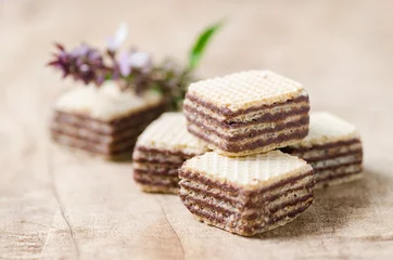  Chocolate wafer on wooden background © nungning20