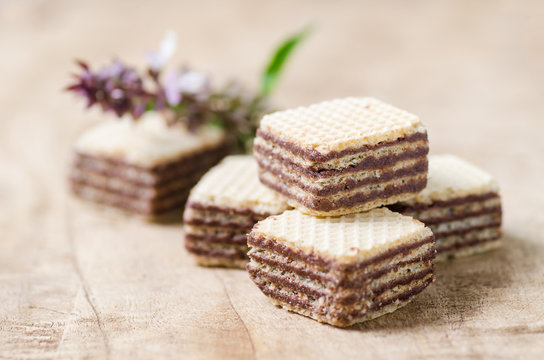 Chocolate wafer on wooden background