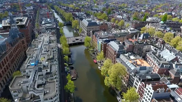 Amsterdam canal shot with a drone, rising up