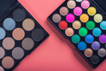 colored cosmetic palette on pink background