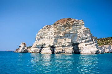 Fototapeta na wymiar Rock formations and sea caves at Kleftiko shoreline in Milos, Greece
