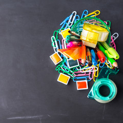 Colorful stationery back to school concept on blackboard background