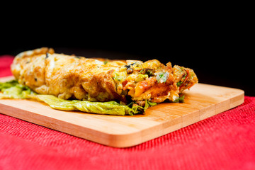 Breakfast omelet with ham tomato and green salad