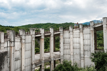 Beautiful mountain landscape, concrete bridge, two girls