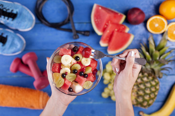 Fruit salad making fresh fruits with sports equipment