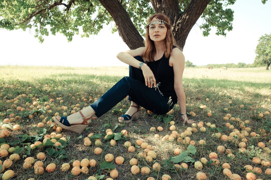 Woman in apricot garden 