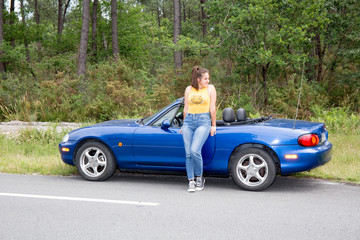 Young girl driving convertible