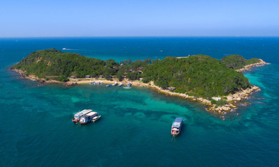 At Sea Island.Aerial view. Top view.amazing nature background.The color of the water and beautifully bright.Azure beach with rocky mountains and clear water of Thailand ocean at sunny day.