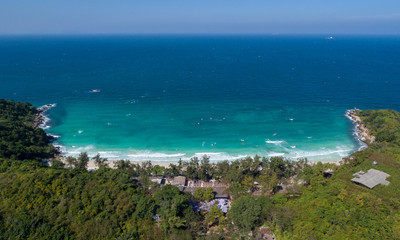Fototapeta na wymiar At Sea Island.Aerial view. Top view.amazing nature background.The color of the water and beautifully bright.Azure beach with rocky mountains and clear water of Thailand ocean at sunny day.