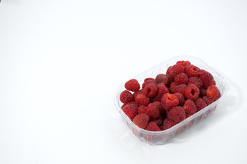 Raspberry in a bowl on a white background