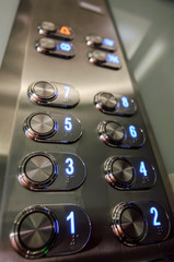 Elevator buttons inside elevator cabin pressing buttons