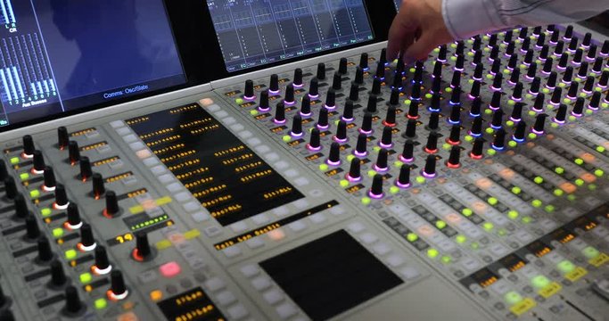 Hands of Audio engineer working. Professional audio mixer, sound engineer, producer control engineer, audio mixing console