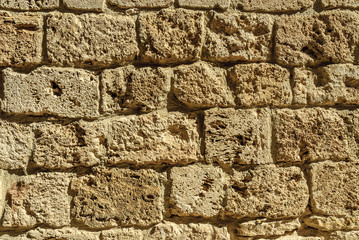 texture with ashlars of a medieval wall in the town of Orbaneja of the Castle in the province of Burgos in Castile and Leon, Spain