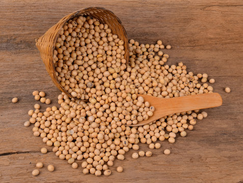 Soybeans on old wood background