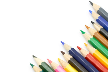 Close up macro shot set of color pencils for school or professional use on white background, copy space