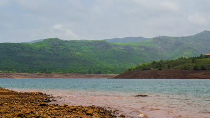 The Lush Green Mountains and Beautiful Muddy Lake of Panshet, Maharashtra, India