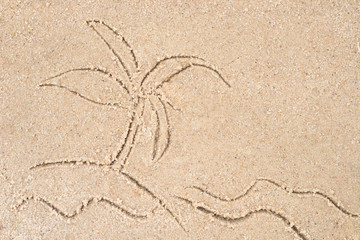 palm on island drawing in sand
