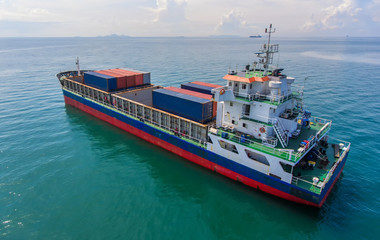 container ship in import export and business logistic.By crane ,Trade Port , Shipping.cargo to harbor.Aerial view.Top view.