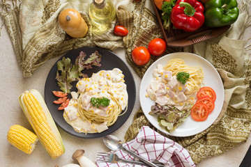 Delicious pasta carbonara with bacon and parmesan in a black bowl. homemade food style
