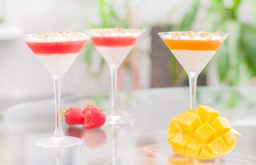 Panna cotta dessert with fruit jelly.