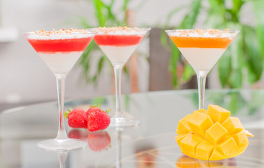 Panna cotta dessert with fruit jelly.