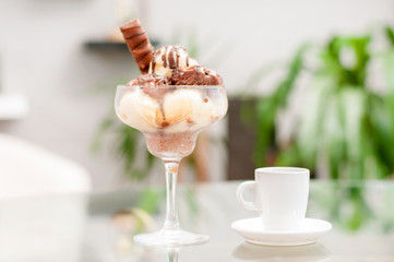 Chocolate and vanilla ice cream and cup of coffee