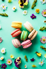 Colorful macaroons and flowers